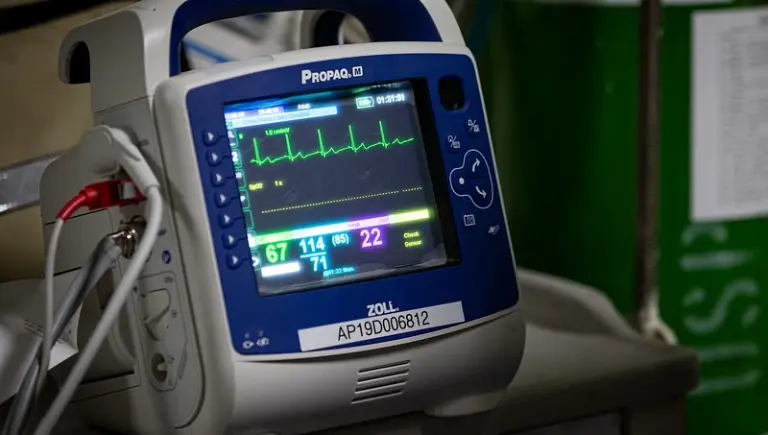 modern heartbeat monitor | Buried in a Coffin